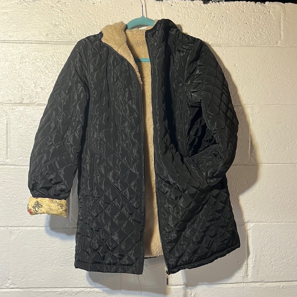 Black jacket with beige fuzzy liner